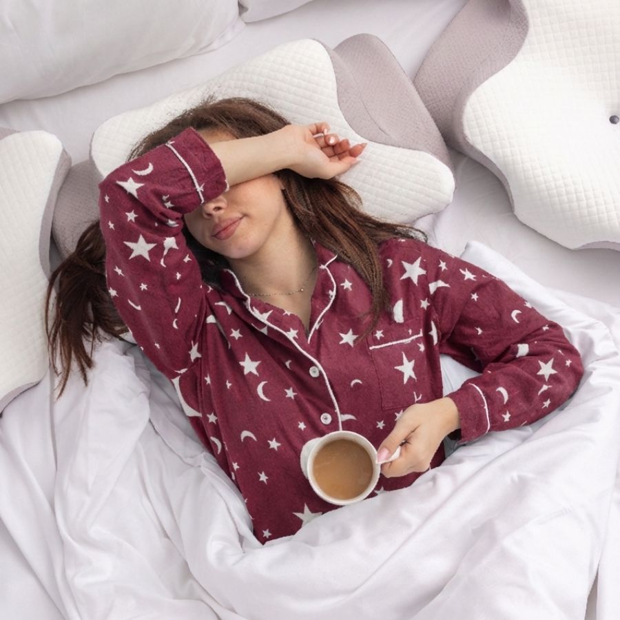 Woman sleeping comfortably on the CloudPuf Butterfly pillow